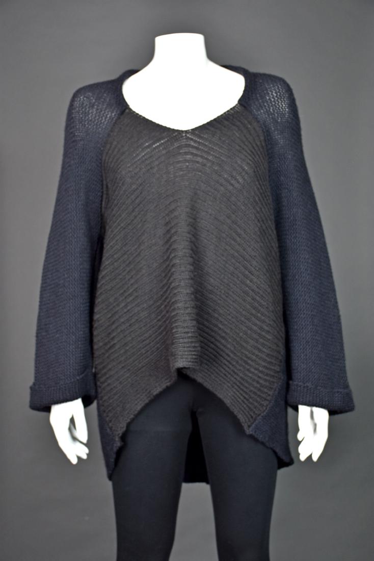 ETRO MILANO Comfy Wool Silk Yak Blend Sweater: Oversized pullover sweater in a high/low design from ETRO is wonderfully slouchy. The extremely soft yarn is a wool, silk and yak blend. The front of the sweater is a dark brown, wide wale knit, and t
