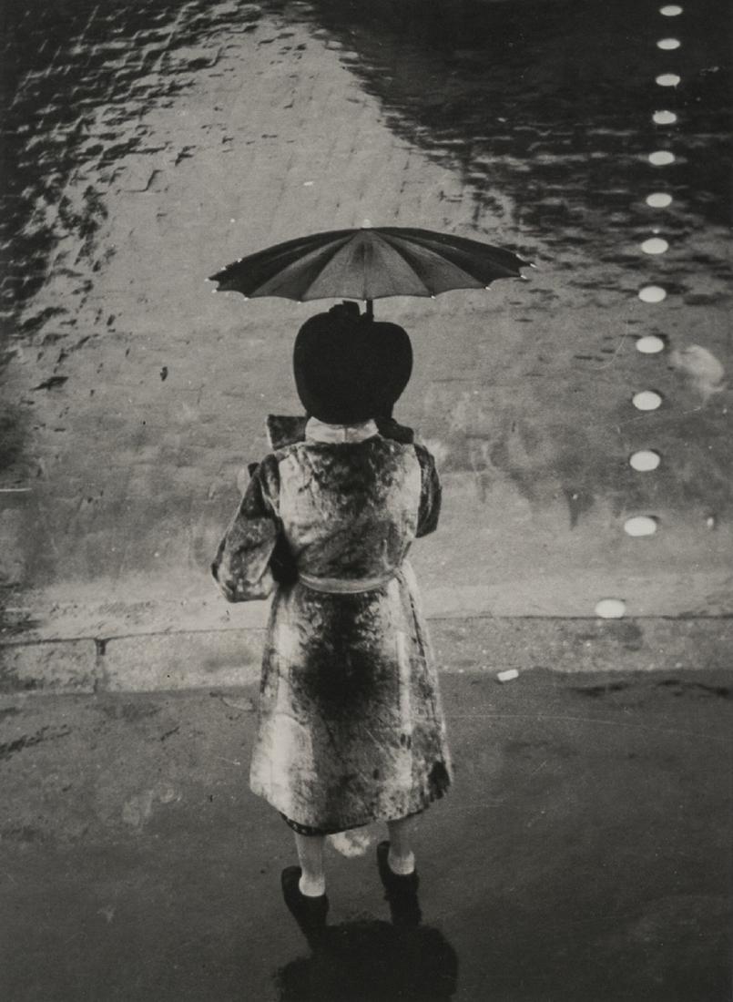 BRASSAI - The Umbrella Woman on Rivoli, 1937: Artist: Brassai Title: The Umbrella Woman on Rivoli, 1937 Medium: Photo Litho, 2001, USA Dimensions: 6.3x8.6" Heat Wax Mounted on 11x14" Conservation Board Brassai was a Hungarian-French photographer