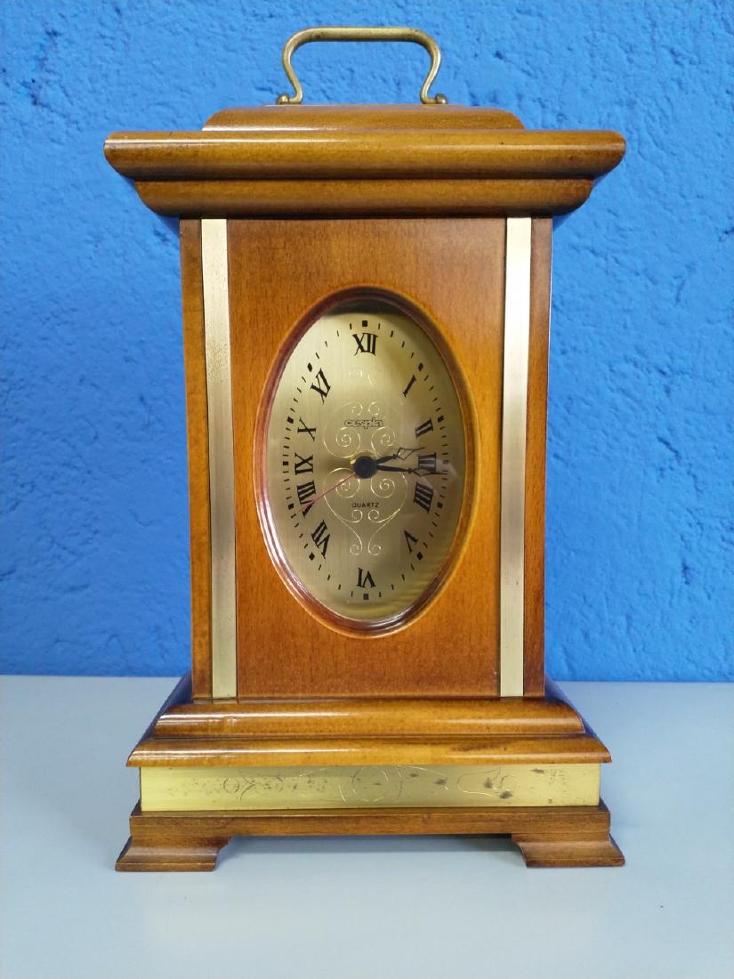 Cespia - Table clock: No Reserve! Title: Cespia - Table clock Date/Period: 70s Materials: Wood / Brass Dimensions: Cm 20,5 x 10,5 x 33 Additional Information: CESPIATable clock with wooden frameBrass detailsBrass dial engr
