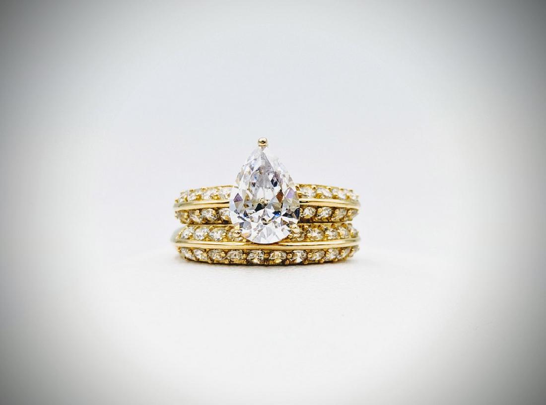 Sz 7 Engagement Ring Set w Cubic Zirconia: Title: Sz 7 Engagement Ring Set w Cubic Zirconia Brand: Jean Lin Collection Metal Purity: Gold Plated 925 Sterling Silver Gemstones: Cubic Zirconia Carat Weights: 1 Pear Shaped Cubic Zirconia at 10×7