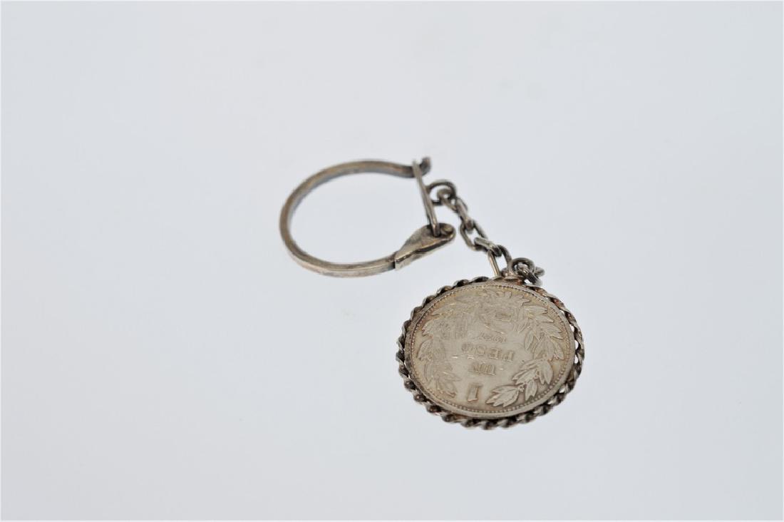 800 Silver 1927 One Peso Mexican Coin on Sterling: Title: 800 Silver 1927 One Peso Mexican Coin on Sterling Silver Keychain Brand: Unbranded Metal Purity: 800 800 silver 1927 one Peso Mexican coin on a sterling silver keychain. DWT 10 Reserve: $20.00