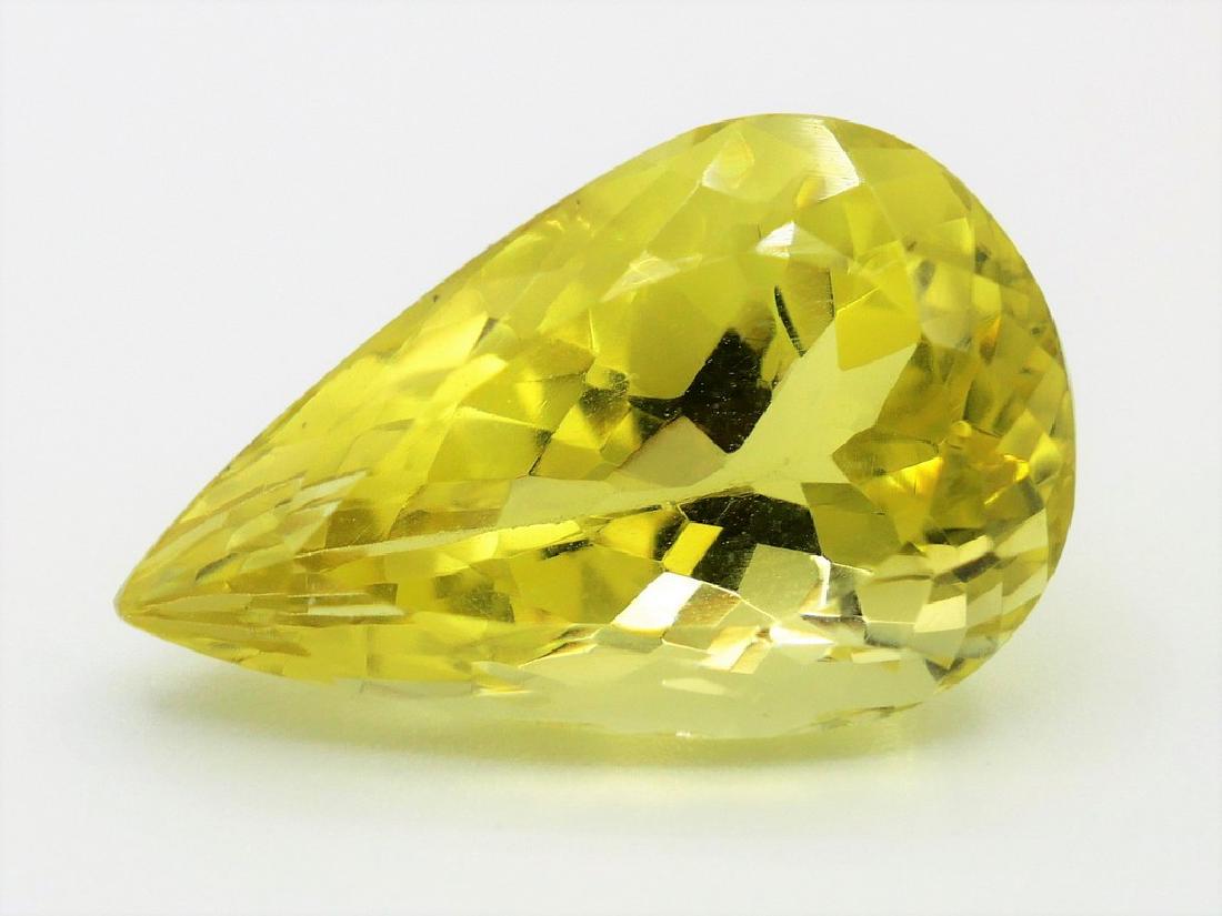Lemon Quartz of 12.32 ct: No Reserve! Title: Lemon Quartz of 12.32 ct Color/Clarity: Yellow Gemstone Type: Lemon Quartz Carat Weights: 12.32 Size/Dimensions: 20.00 x 12.70 x 10.00 mm Additional Information: Pear Mixed Cut Ship