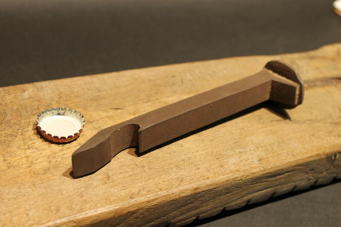 Iron Railroad Spike Soda Beer Bottle Cap Opener: 6 3/4" Long x 1 3/4" Wide Great reproduction heavy solid iron bottle opener. This piece was made to look just like an antique, but is actually new made. Great for use or display! Reserve: $16.00 Shipp