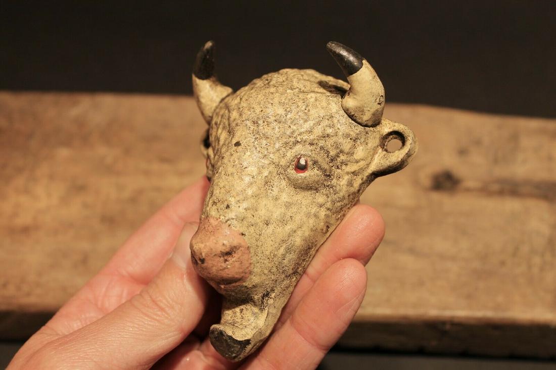 Cast Iron Folk Art Beer Soda Bottle Buffalo Opener: 4" Tall x 3 3/8" Wide Such a neat reproduction of an antique cast iron buffalo bottle opener. This opener is all cast iron, cast from an antique, hand painted, and lightly distressed to look old. It i