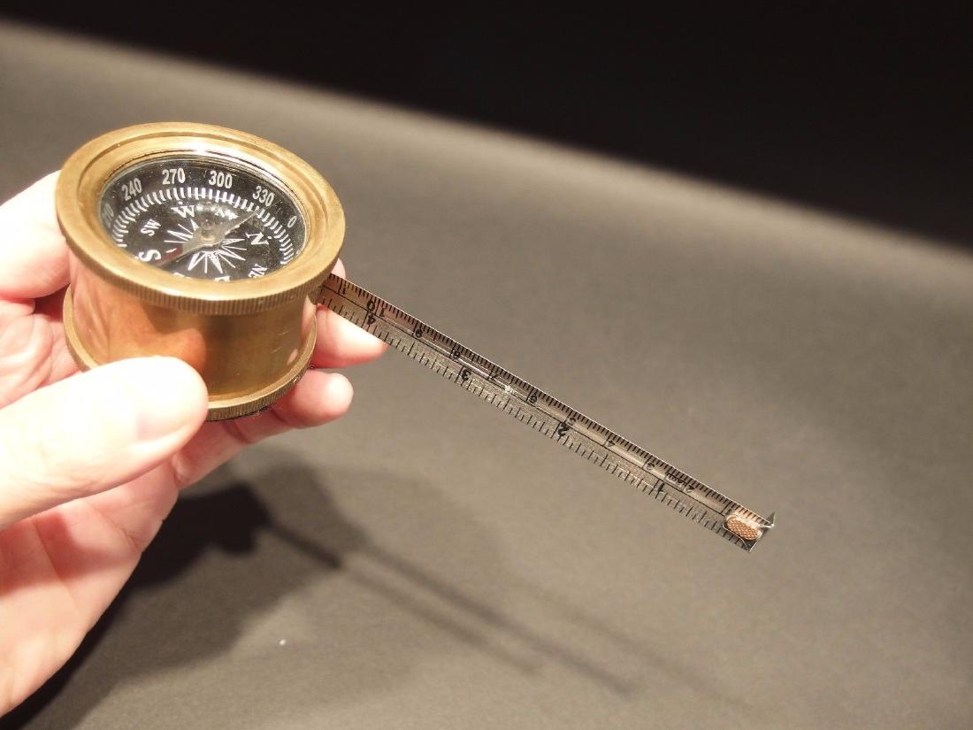 Brass Compass Measuring Tape Measure: 1 1/8" wide x 1 1/2" high Nice reproduction of an antique compass with a built in tape measure that goes to 76". Great heavy quality piece! Reserve: $25.00 Shipping: Domestic: Flat-rate of $6.00 to an