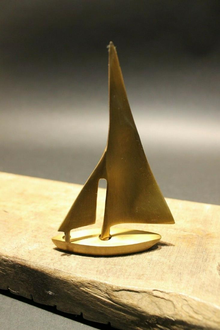 5" Brass Sail Boat Paperweight Desk: 4 1/4" Tall 3 1/4" Wide Very accurate and well made reproduction of an antique paperweight. All solid brass, darkened to look old. Certainly easy to wonder its age Reserve: $15.00 Shipping: Domestic: