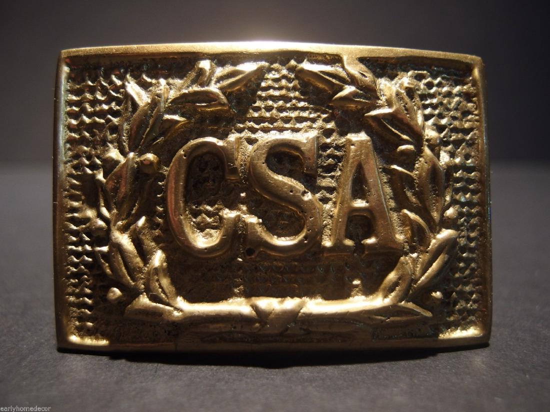 Civil War Confederate CSA Belt Buckle Plate SOLID Brass: Antique Style Civil War Confederate CSA Belt Buckle Plate SOLID Brass Description 2 5/8" Wide x 1 3/4" High This all solid brass replica belt plate will surely make you wonder its age. It is made to l
