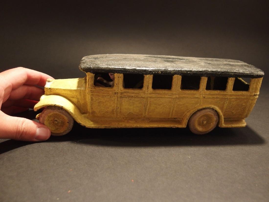 Cast Iron Yellow Bus Toy Car: 10 1/2" Long x 3" Wide 3 1/4" Tall 4 lbs Such a neat reproduction cast iron bus! As you can see this heavy cast iron bus was wonderfully cast and hand painted then distressed to look original. The bus