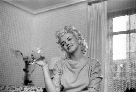 Quiet Moment: Artist: Ed Feingersh Title: Quiet Moment Medium: Silver Gelatin Year: 1955 Height/Width: 16x20 in Description: Actress Marilyn Monroe relaxes on a couch in her hotel room at the Ambassador Hotel on