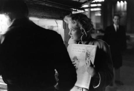 Marilyn Gets The Paper: Artist: Ed Feingersh Title: Marilyn Gets The Paper Medium: Silver Gelatin Year: 1955 Height/Width: 16x20 in Description: Actress Marilyn Monroe picks up a copy of the New York Dail Post newspaper at