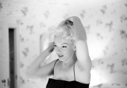 Marilyn Getting Ready To Go Out: Artist: Ed Feingersh Title: Marilyn Getting Ready To Go Out Medium: Silver Gelatin Year: 1955 Height/Width: 16x20 in Description: Actress Marilyn Monroe prepares to go out to the play ‘Cat On A