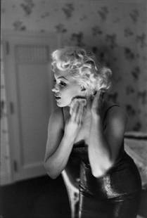Marilyn Getting Ready To Go Out: Artist: Ed Feingersh Title: Marilyn Getting Ready To Go Out Medium: Silver Gelatin Year: 1955 Height/Width: 12 x 10 in Description: Actress Marilyn Monroe gets ready to go see the play ‘Cat On A