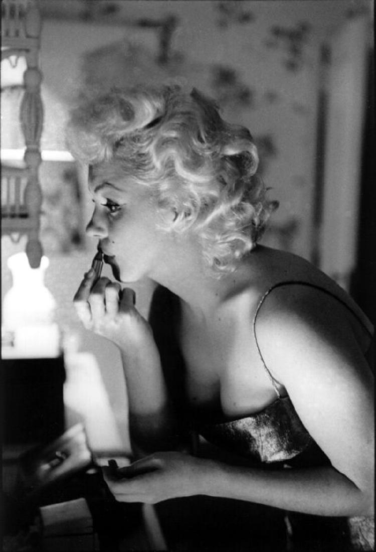 Marilyn Getting Ready To Go Out: Artist: Ed Feingersh Title: Marilyn Getting Ready To Go Out Medium: Silver Gelatin Year: 1955 Height/Width: 12 x 10 in Description: Actress Marilyn Monroe gets ready to go see the play ‘Cat On A Hot