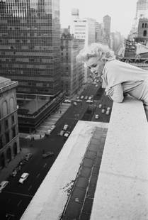 Marilyn On The Roof: Artist: Ed Feingersh Title: Marilyn On The Roof Medium: Silver Gelatin Year: 1955 Height/Width: 40 x 30 in Description: American actress Marilyn Monroe (1926 – 1962) leans over the balcony of the