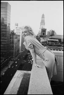 Marilyn On The Roof: Artist: Ed Feingersh Title: Marilyn On The Roof Medium: Silver Gelatin Year: 1955 Height/Width: 60 x 40 in Description: American actress Marilyn Monroe (1926 – 1962) leans over the balcony of the