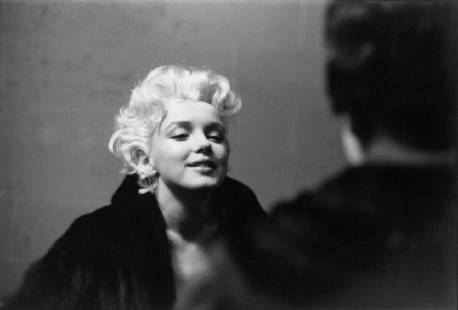 Marilyn Takes It To The Streets: Artist: Ed Feingersh Title: Marilyn Takes It To The Streets Medium: Silver Gelatin Year: 1955 Height/Width: 10 x 12 in Description: Movie star Marilyn Monroe is seen in a candid moment on the street