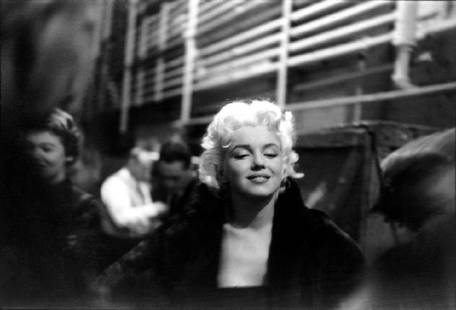 Marilyn Takes It To The Streets: Artist: Ed Feingersh Title: Marilyn Takes It To The Streets Medium: Silver Gelatin Year: 1955 Height/Width: 16x20 in Description: Movie star Marilyn Monroe is seen in a candid moment on the street