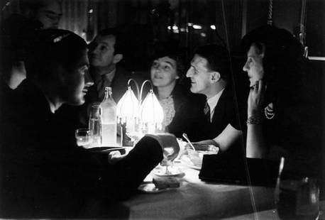 At The Embassy: Artist: Bert Hardy Title: At The Embassy Medium: Silver Gelatin Year: 1941 Height/Width: 12 x 16 in Description: A group of people at the Embassy Club in London during World War II 1941. A beautiful