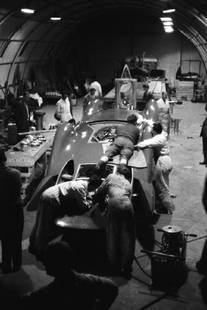 Bluebird Workshop: Artist: Bert Hardy Title: Bluebird Workshop Medium: Silver Gelatin Year: 1960 Height/Width: 20 x 16 in Description: Technicians working on the Bluebird-Proteus CN7 Land Speed Record-breaking car in a