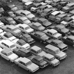 Car Park: Artist: Bert Hardy Title: Car Park Medium: Silver Gelatin Year: 1965 Height/Width: 12 x 12 in Description: Cars packed together in a BMC car park, July 1965. A beautiful Limited Edition (ed size