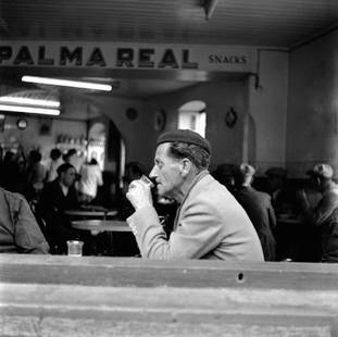Drinking Man: Artist: Bert Hardy Title: Drinking Man Medium: Silver Gelatin Year: 1954 Height/Width: 16 x 16 in Description: A man having a drink at a cafe in Gibraltar. 1954. A beautiful Limited Edition (ed size