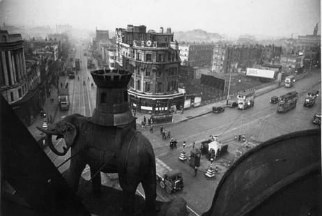 Elephant And Castle: Artist: Bert Hardy Title: Elephant And Castle Medium: Silver Gelatin Year: 1949 Height/Width: 16 x 20 in Description: 8th January 1949: The Elephant and Castle in the London Borough of Southwark,