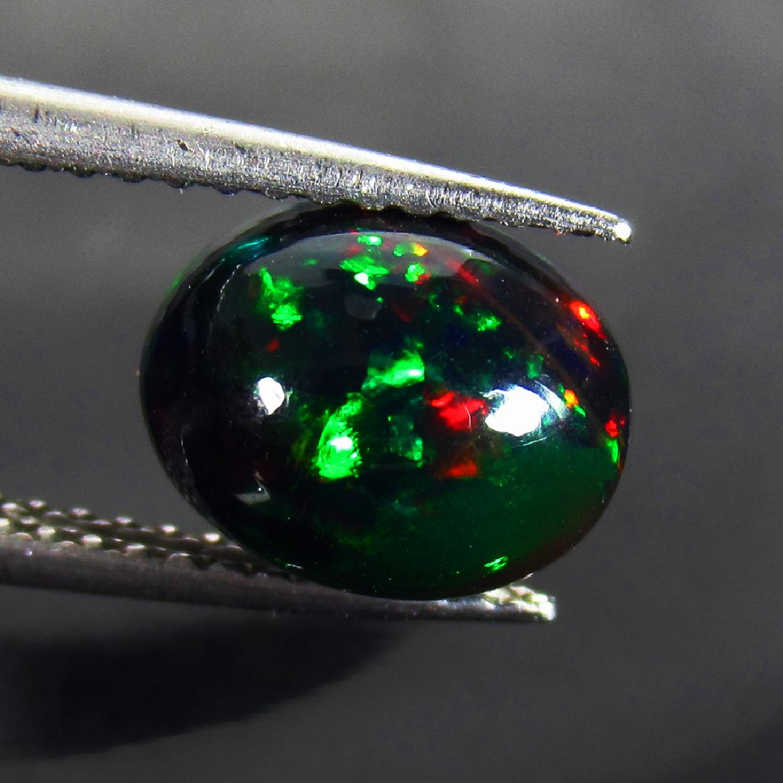 1.45 Ct Natural Ethiopian Black Opal 9X7 mm Oval Cab (1 of 2)