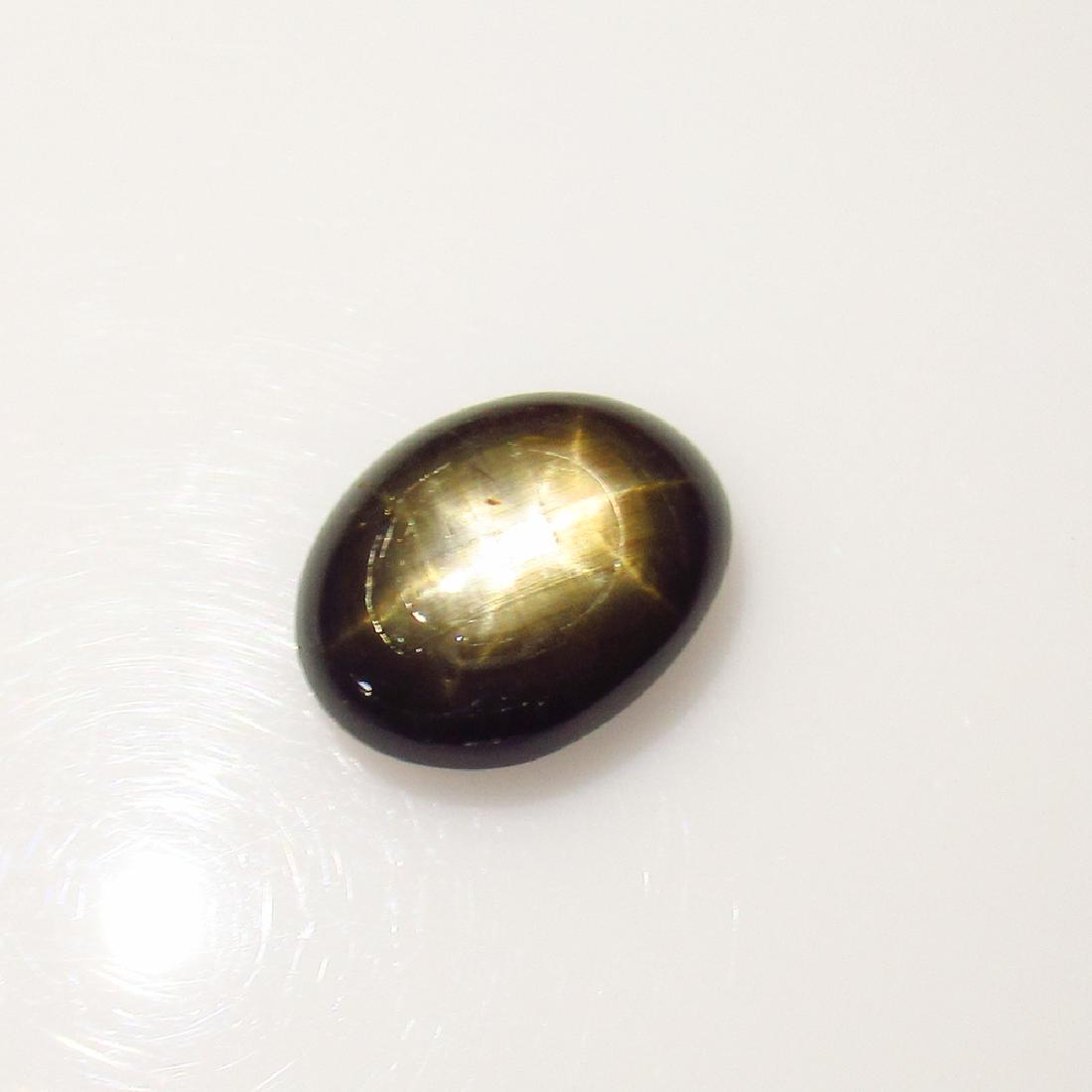 4.90 Ct Genuine Six Line Black Star Sapphire Oval Cab: No Reserve! Title: 4.90 Ct Genuine Six Line Black Star Sapphire Oval Cab Stone Clarity: Opaque Loose Gemstone: Natural Black Star Sapphire Carat Weights: 4.90 Size / Dimensions: 11.40 x 8.80 x 4.50 mm