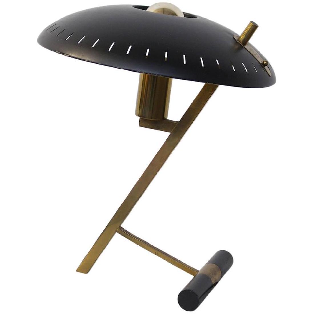 Louis Kalff for Philips First Edition Desk or Table: An iconic Dutch-industrial desk or table lamp designed by designer and architect Louis Kalff; for the Philips Company, Holland, 1955. This is the first edition with a brass frame and the black disk-sh