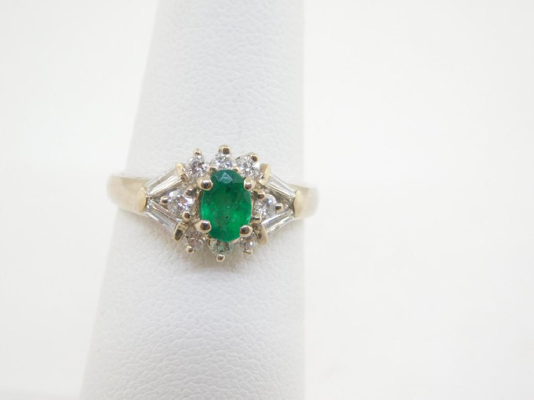 18K White Gold 52pt Emerlad 40pts Diamond ring G-H VS2: Title: 18K White Gold 52pt Emerlad 40pts Diamond ring G-H VS2 SI1 3.4 grams size 5 Metal Purity: 18K WG Gemstones: emerald/diamond Carat Weights:52pts Emerald Size/Dimension: 40pts tw Diamonds, G-H VS