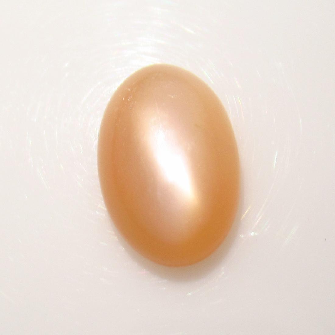 6.57 Ctw Natural Orange Moonstone Catseye Oval Cab: No Reserve! Title: 6.57 Ctw Natural Orange Moonstone Catseye Oval Cab Stone Clarity: Transparent Gemstones: Moonstone Catseye Size/Dimensions: 14.80 x 10.10 x 6.00 mm Carat Weights: 6.57 Additional In