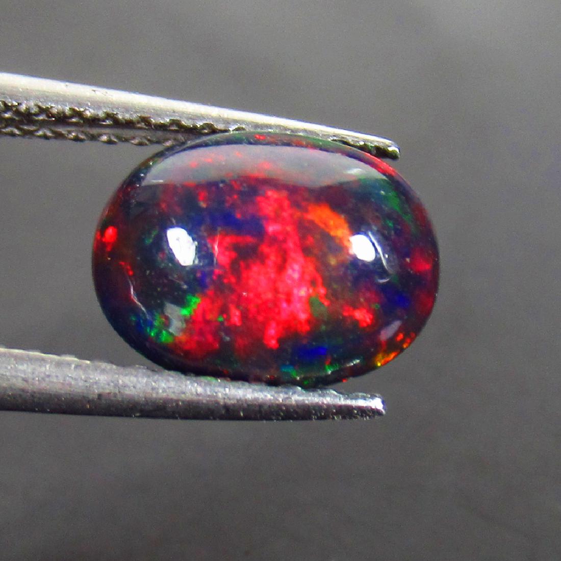 1.24 Ct Natural Ethiopian Black Opal 9X7 mm Oval Cab (1 of 2)