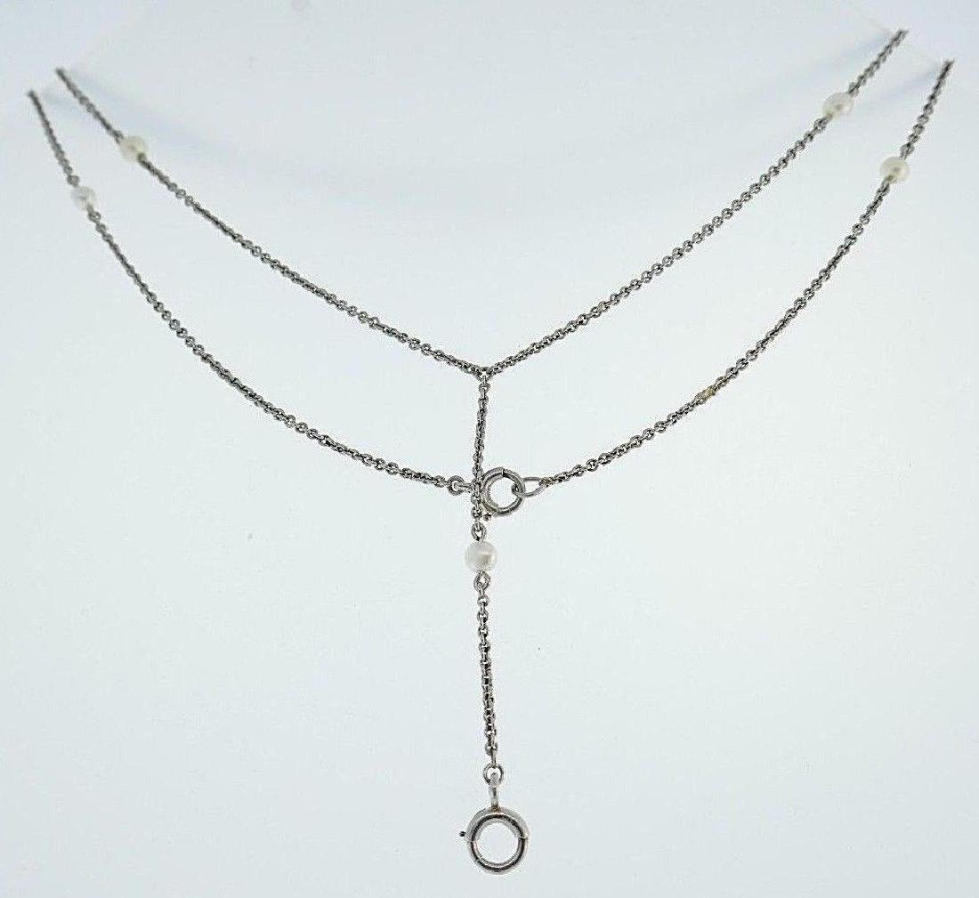 Vintage Platinum Natural Pearls Chain Necklace: 90212NS R00 Vintage platinum chain necklace features natural pearls Has a hanging part in the middle (used to be a watch chain) to hang a pendant of your choice Measurements: 1/16" W x 23 1/2" L, the