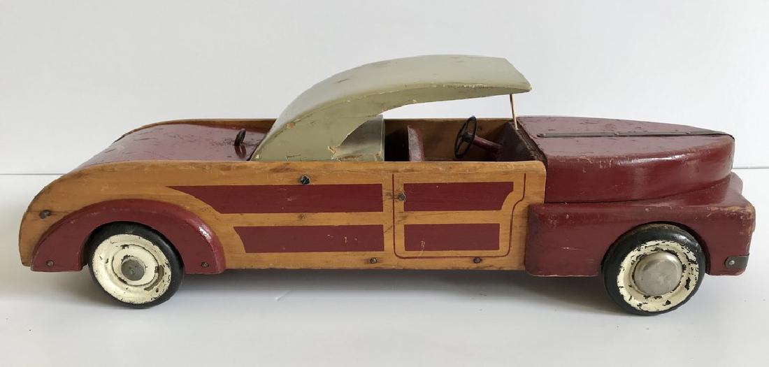 Buddy L: Title: Buddy L Date: 1940’s Dimensions: 19” long Provenance/Additional Information: Town and Country wood convertible / hardtop Shipping: Domestic: Flat-rate of $30.00 to anywhere within the conti