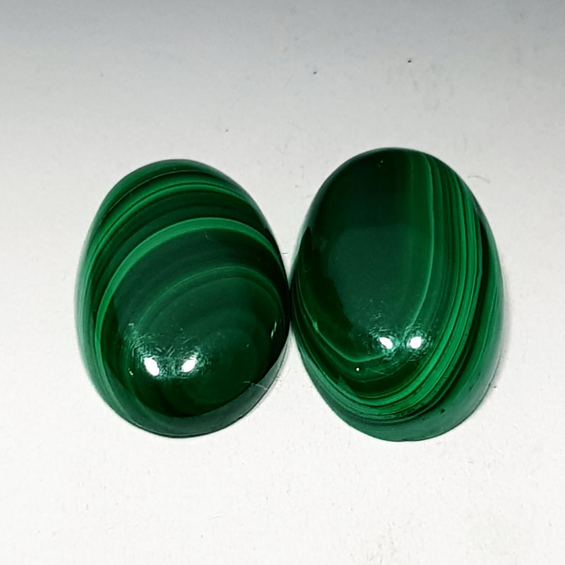 12.65 ct Pair of Natural Malachite: No Reserve! Title: 12.65 ct Pair of Natural Malachite Color/Clarity: Opaque Gemstones: Loosegemstone Carat Weights: 12.65 Size/Dimensions: 14.60 x 9.90 x 3.50/15.10 x 10.00 x 4.20 Additional Informati