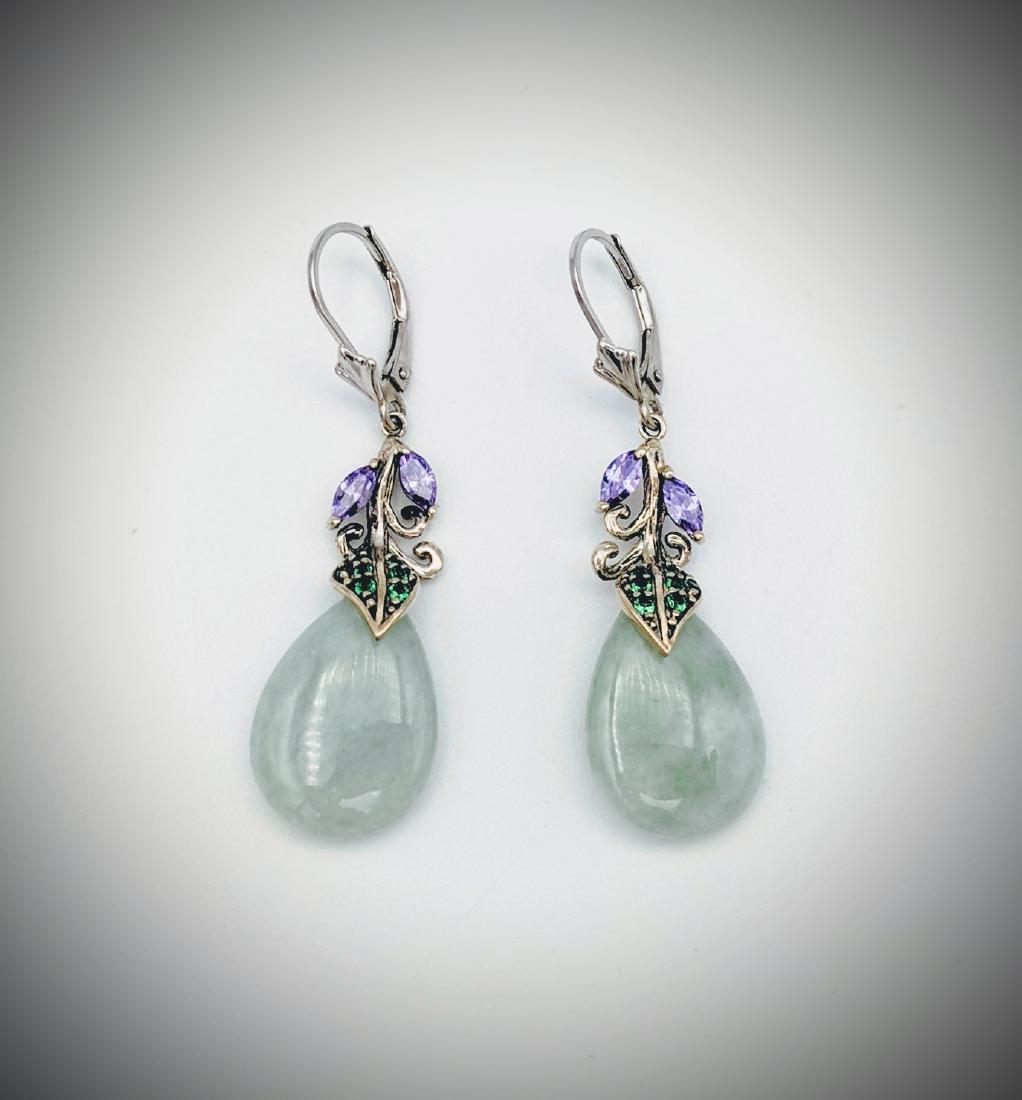 Jade, Amethyst and Tsavorite Garnet Earrings: Title: Jade, Amethyst and Tsavorite Garnet Earrings Brand: Jean Lin Collection Metal Purity: 925 Sterling Silver Gemstones: Jade, Amethyst, and Tsavorite Garnet Carat Weights: Each Earring has 2 Marqu