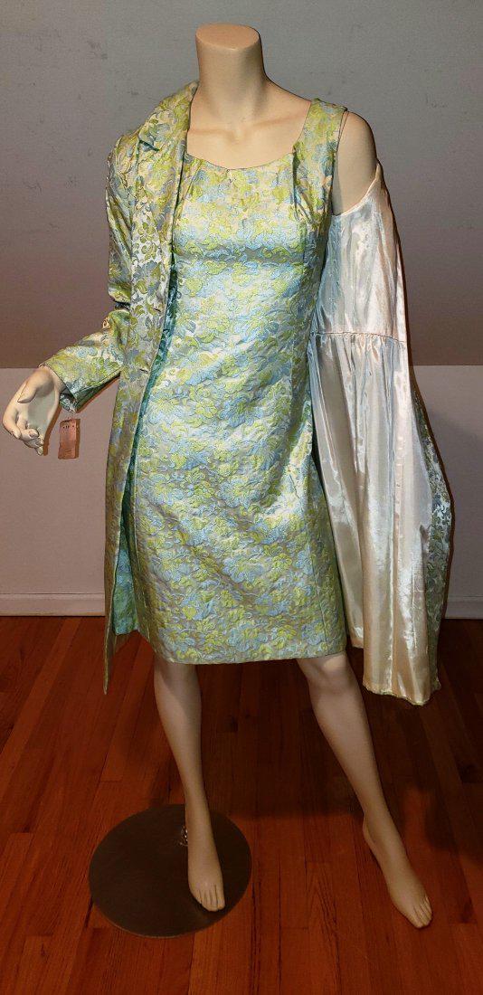 Vtg 1950 Floral Brocade dress and Opera coat ensmble: Amazing in look and coloration this ensmble is very beautiful in a green blue coloration , with amazing conch buttons. Fylly lined with satin. A Size SIn very good vintage condition Please note that t