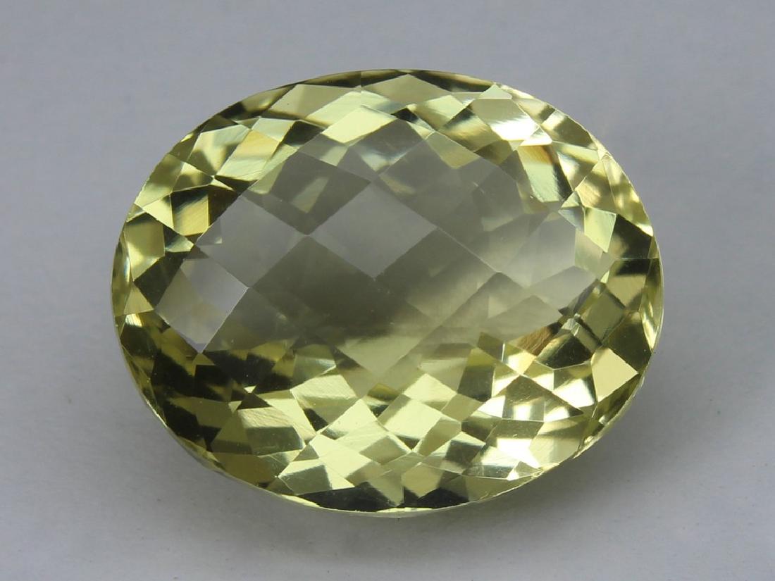 8.61 Ct Natural Lemon Quartz: No Reserve! Title: 8.61 Ct Natural Lemon Quartz Additional Information: Gemstone : Lemon QuartzOrigin : BrazilWeight : 8.61 CtDimensions : 14.6x12x.3 mmShape : Oval CUtColor : Light YellowClarity : VV