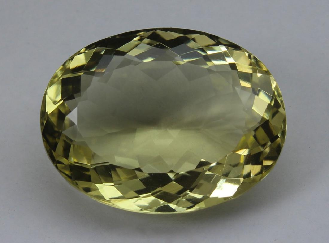 12.54 Ct Natural Lemon Quartz: No Reserve! Title: 12.54 Ct Natural Lemon Quartz Additional Information: Gemstone : Lemon QuartzOrigin : BrazilWeight : 12.54 CtDimensions : 18.2x13.8x8 mmShape : Oval CUtColor : Light YellowClarity :