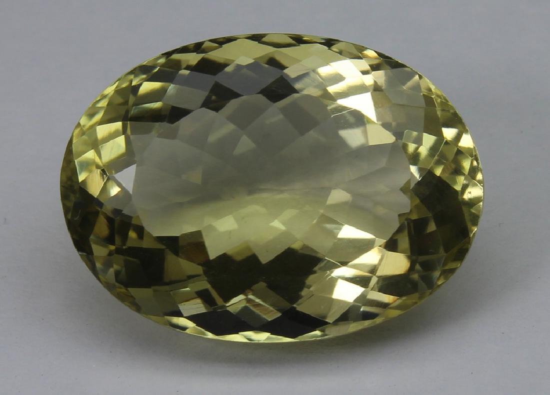 11.85 Ct Natural Lemon Quartz: No Reserve! Title: 11.85 Ct Natural Lemon Quartz Additional Information: Gemstone : Lemon QuartzOrigin : BrazilWeight : 11.85 CtDimensions : 18x13.2x8.5 mmShape : Oval CUtColor : Light YellowClarity :