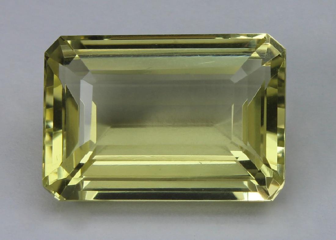 12.11 Ct Natural Lemon Quartz: No Reserve! Title: 12.11 Ct Natural Lemon Quartz Additional Information: Gemstone : Lemon QuartzOrigin : BrazilWeight : 12.11 CtDimensions : 16.8x11.7x8 mmShape : Emerald CutColor : Light YellowClarit