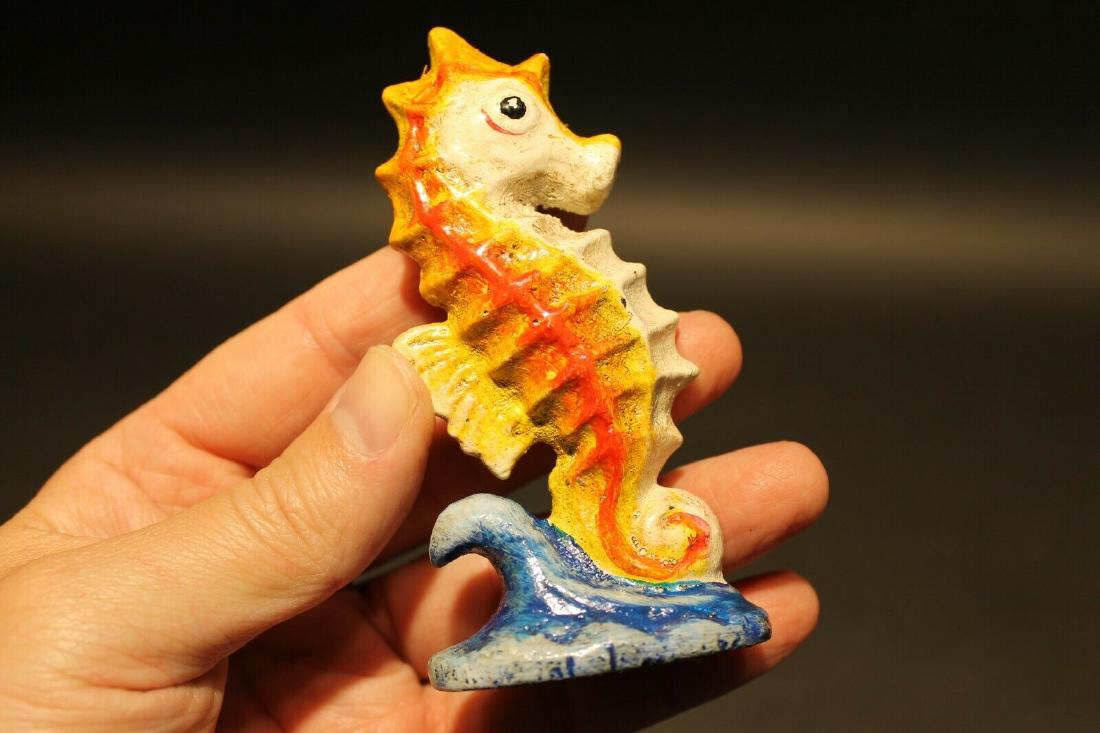 Cast Iron Seahorse Beer Bottle Opener bar tool: 4" Tall x 2" tall Great reproduction cast iron bottle opener. This piece was made to look just like an antique, but is new. Great for use or display! Reserve: $14.00 Shipping: Domestic: Flat-rate of $