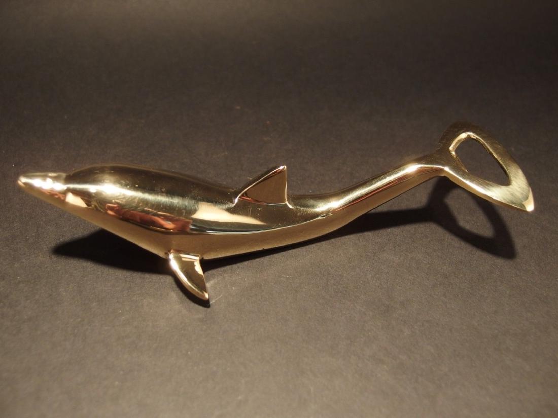 Brass Dolphin Soda Beer Bottle Cap Opener: 6 1/2" Long ..2 1/2" Wide Great reproduction heavy solid brass dolphin bottle opener. This piece was made to look just like an antique, but is actually new. Nicely made all solid brass in the form of 