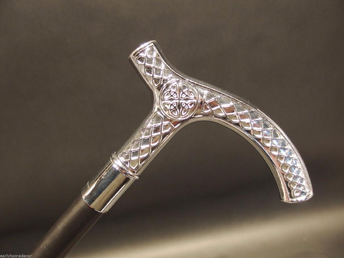 Silver & Black Celtic Metal Slim Walking Stick Cane: 36" Long,.. Handle is 5 1/2" Long 7/8" circumference Wonderful reproduction walking cane, cast from an original. The handle is all heavy solid metal with a hollow metal shaft. Nice quality! Reserve: $