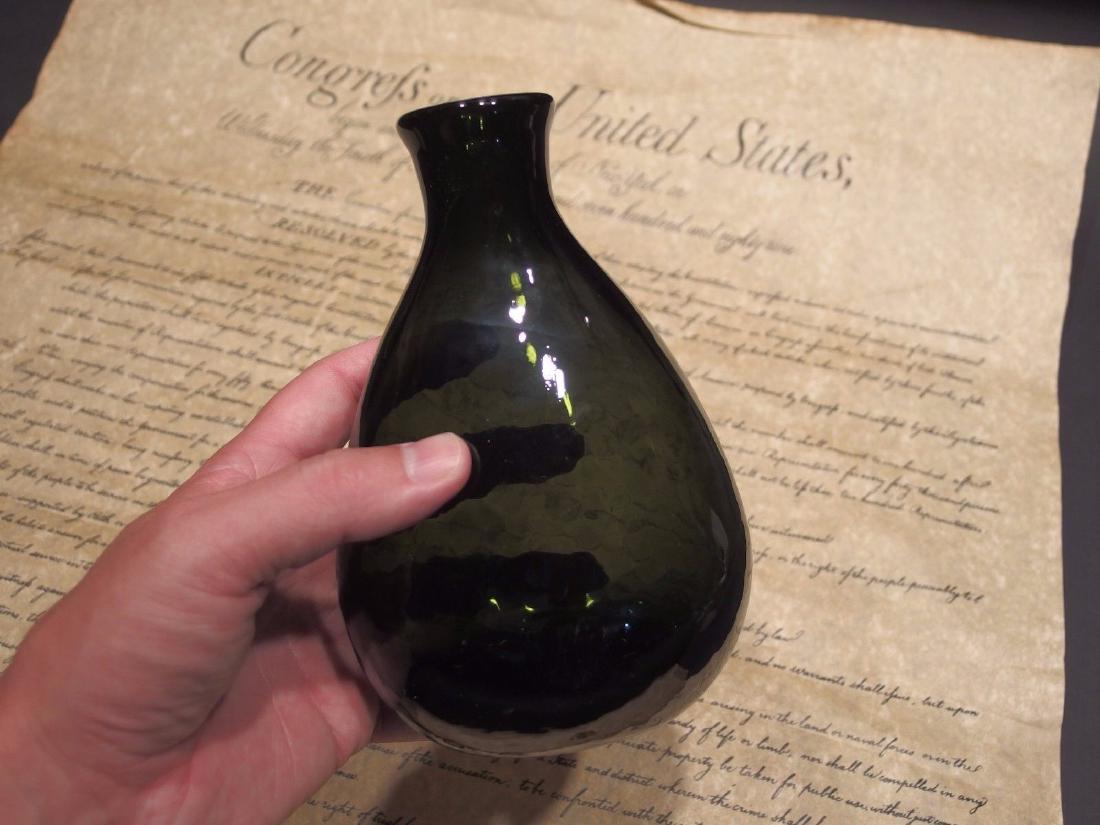 Colonial Black Glass Blown Flask Bottle (Green): Antique Vintage Style Colonial Black Glass Blown Flask Bottle (Green) Description 7" Tall x 4 1/2" Wide Great reproduction flask bottle with a polished pontil. See the images the bottom has some scrat