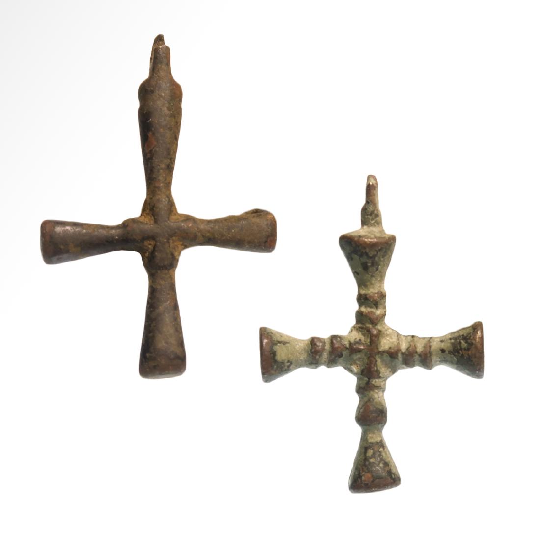 Two Byzantine Bronze Crosses, c. 6th Century A.D.: Title: Two Byzantine Bronze Crosses, c. 6th Century A.D. Date and Origin: Byzantine, c. 6th Century A.D. Description:Both with flaring cylindrical arms, loop for suspension. Material: Bronze Dimension