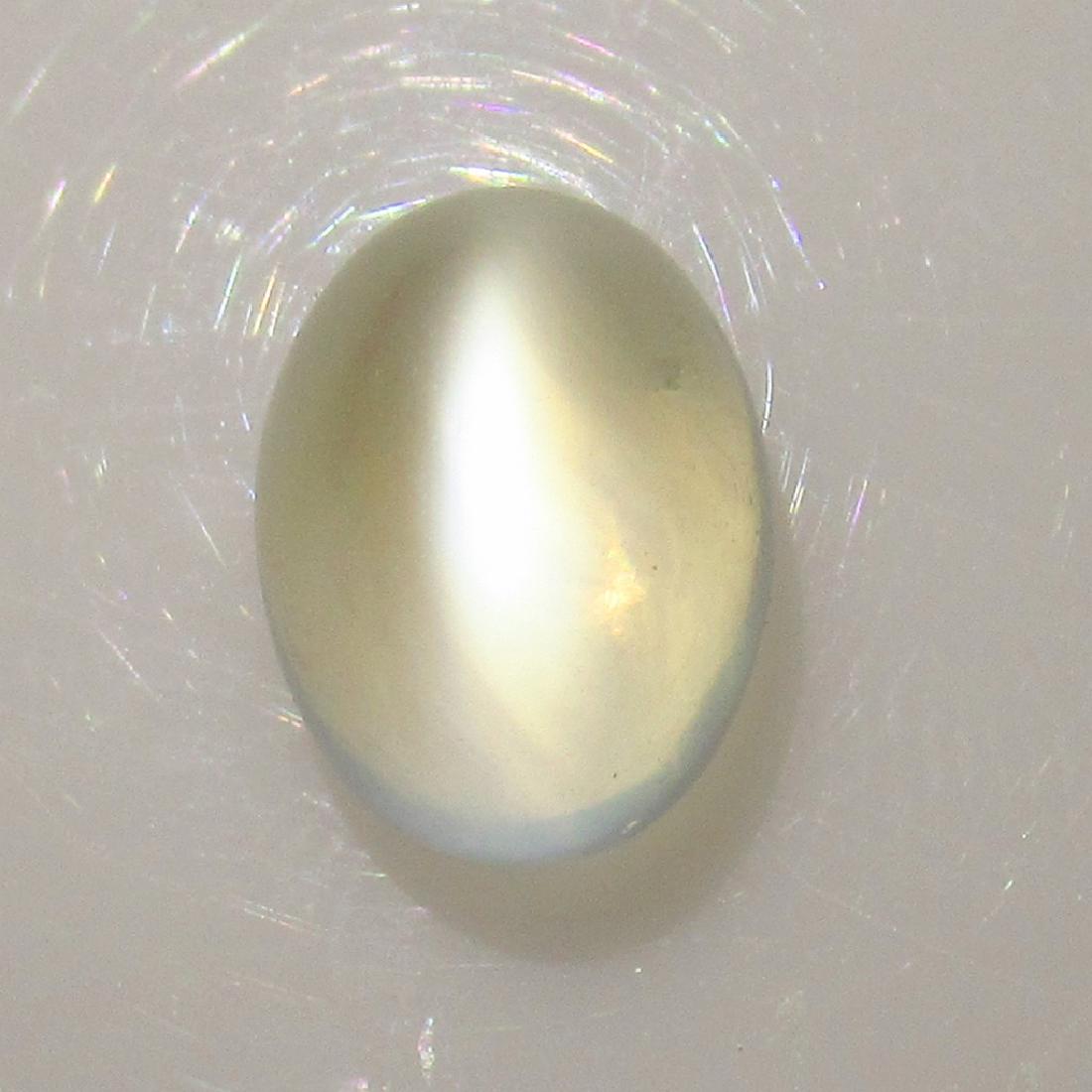 2.93 Ctw Natural White Moonstone 9.5X7 mm Oval: No Reserve! Title: 2.93 Ctw Natural White Moonstone 9.5X7 mm Oval Stone Clarity: Transparent Gemstone: Moonstone Size/Dimension:2.93 Carat Weights: 9.40 x 7.10 x 6.10 mm Additional Information: Nice O