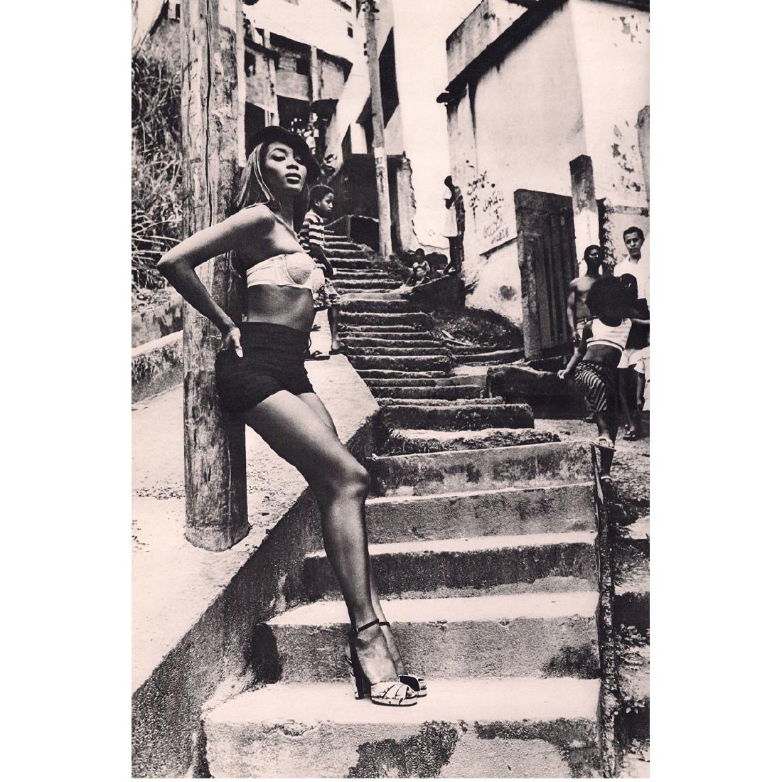 ELLEN VON UNWERTH - Naomi stepping out in Rio, 1991: Artist: ELLEN VON UNWERTH Print Title: Naomi stepping out in Rio, 1991 Medium: Sheet-fed Gravure Printing Date: 1990's Printed in Japan Image size approx. 9 x 13.5 inches Ellen Von Unwerth is a photog