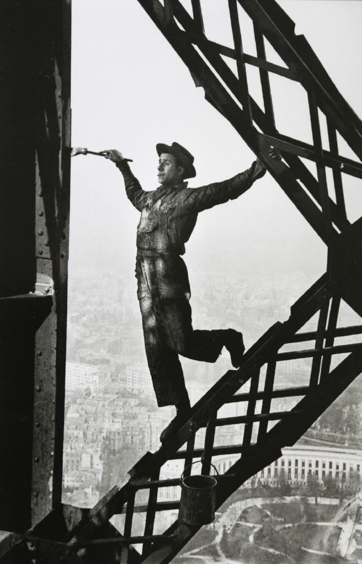 MARC RIBOUD - Painter on the Eiffel Tower, Paris, 1953: Artist: Marc Riboud Title: Painter on the Eiffel Tower, Paris, 1953 Date Printed: 2011 Medium: Photo-lithograph with Marc Riboud / Magnum Photos copyright Printer Location: Printed in Italy Size: 23 x