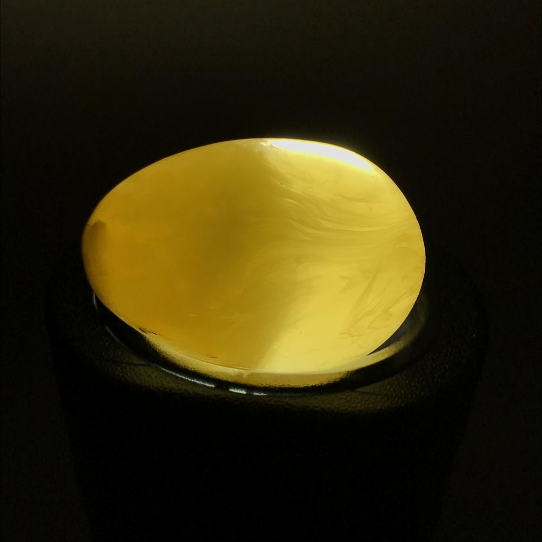 Decorative amber egg yellow 43x30mm: Title: Decorative amber egg yellow 43x30mm Gemstones: Bakelite Weight: 25 gr Size: length 43mm diameter 30mm Additional Information: Melted amber bakelite Reserve: $20.00 Shipping: Worldwide: Flat-ra